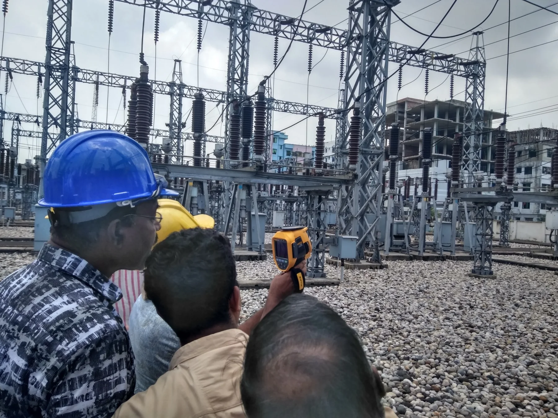 PGCB personnel using a Fluke thermal imager during live substation inspection in Chattogram