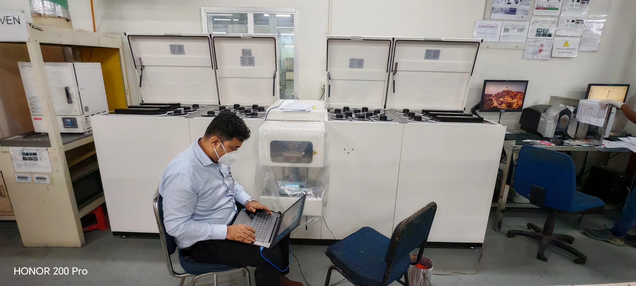 Technical support activity beside the SANTINT paint tinting machine at the Bangladesh client site
